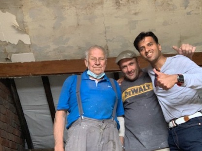 Three team members, Mel (white), Florin (Romanian) and Prithvi (Indian) mid loft conversion project, smiling with thumbs up